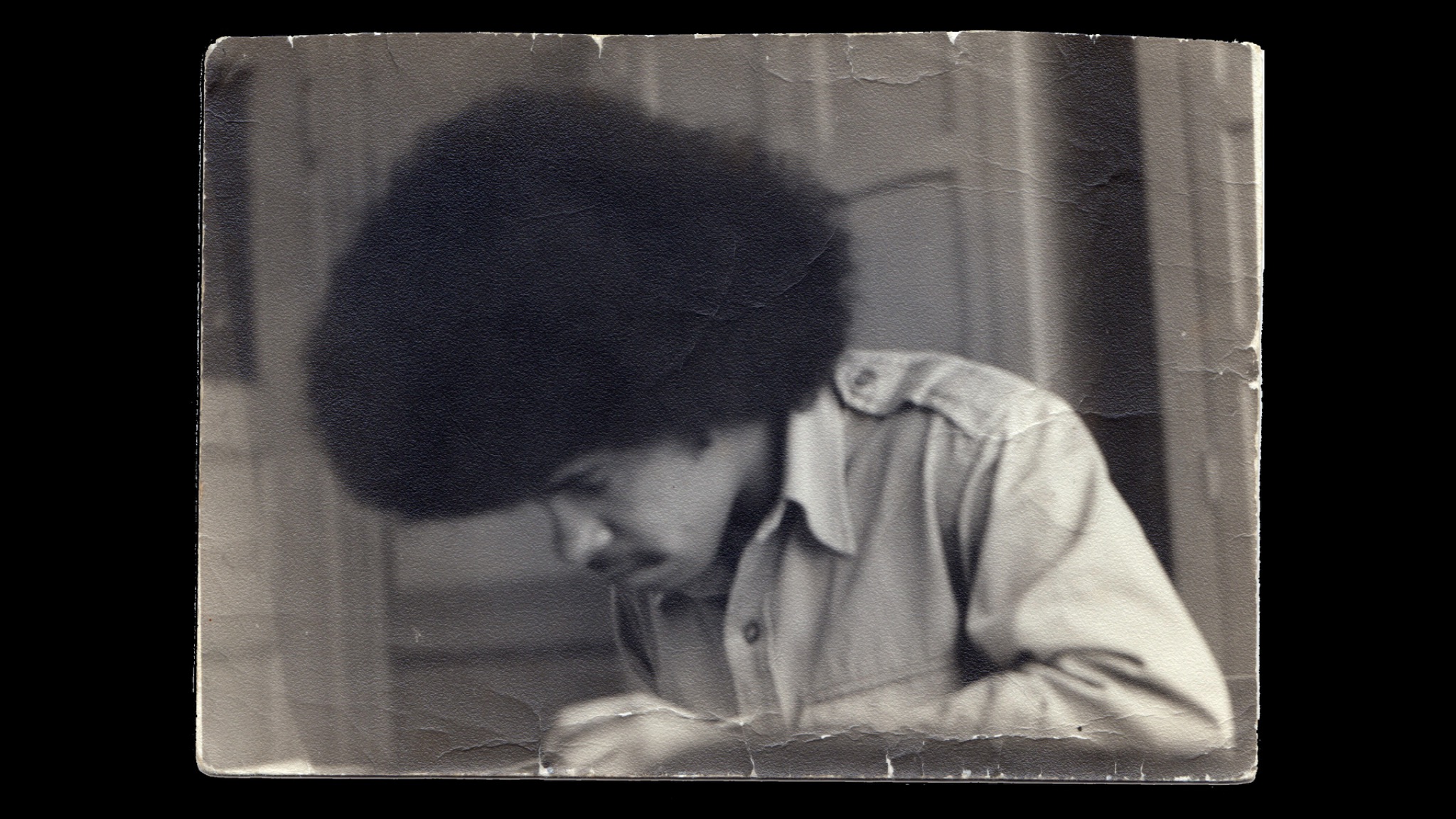 Papoleto as a teenager writing